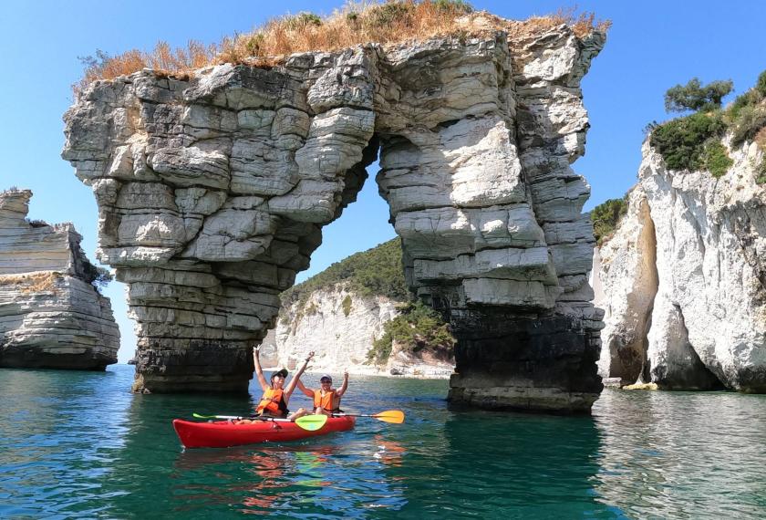Kayak excursion among the sea caves and the Faraglioni of the Gargano